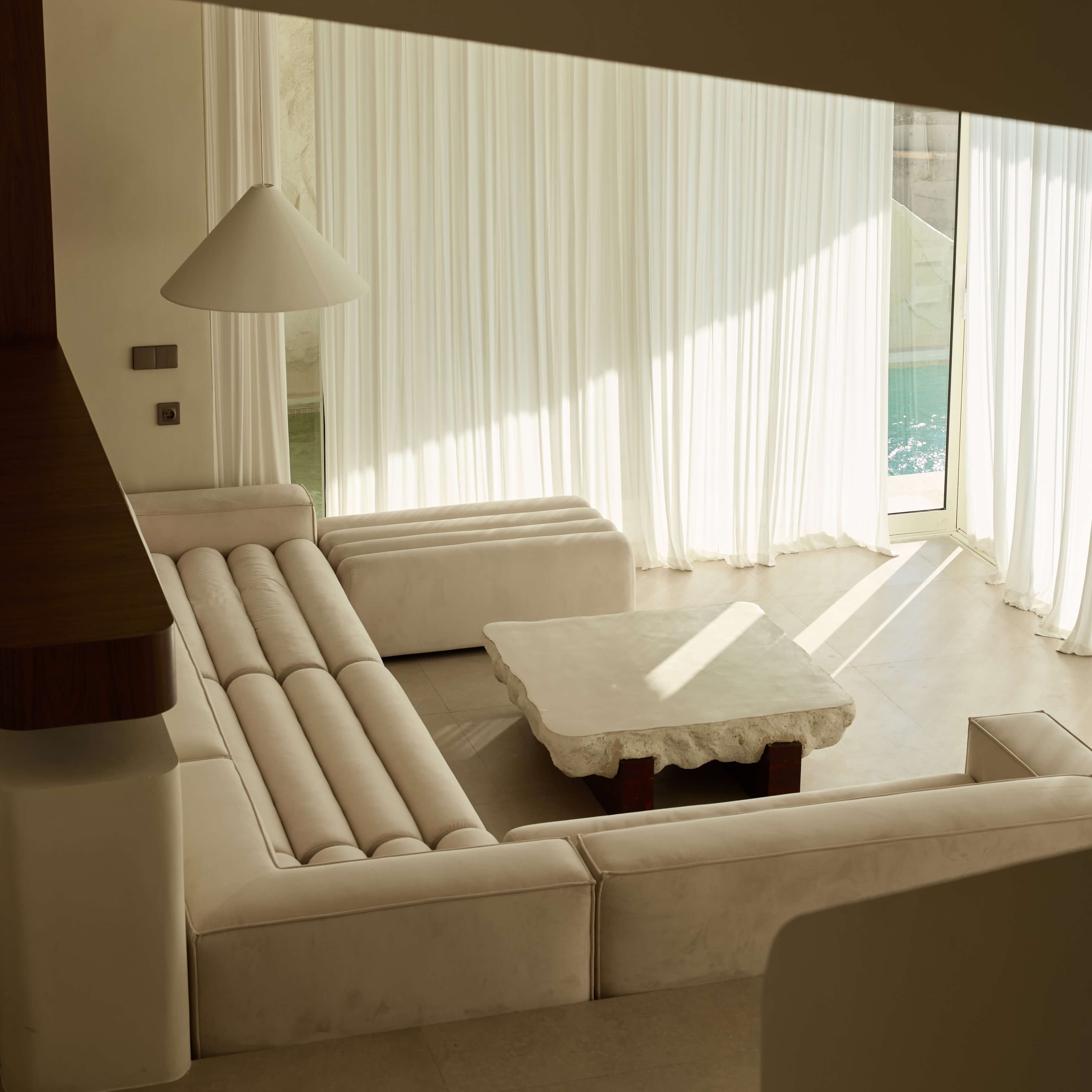 Sunlit lounge inside a FIRA suite