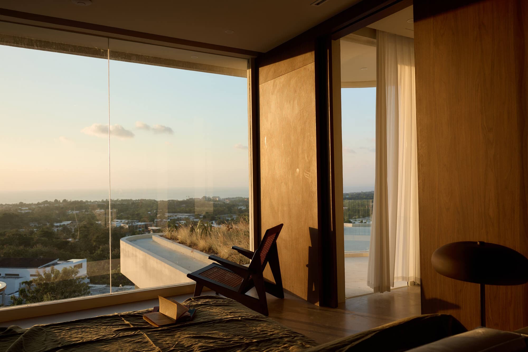 FIRA suite overlooking the Uluwatu coastline at sunset
