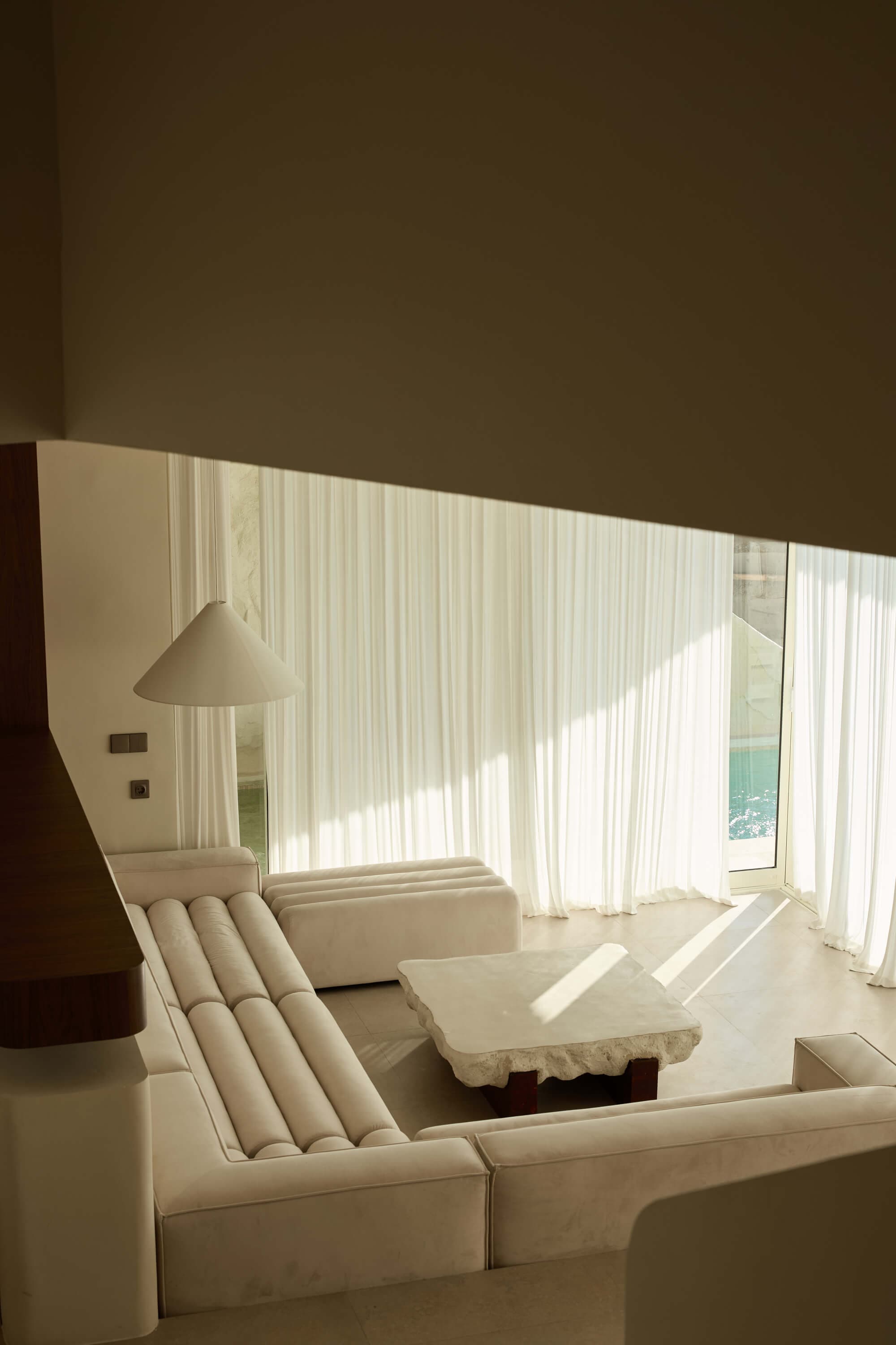 Sunlit lounge inside a FIRA suite